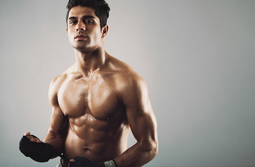 Hispanic male athlete with muscular physique