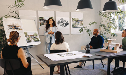 Team collaboration on architectural project during a project management team meeting