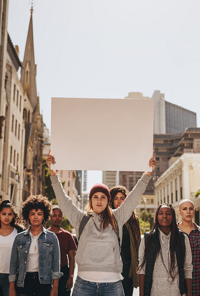 Multiracial group of females protesting
