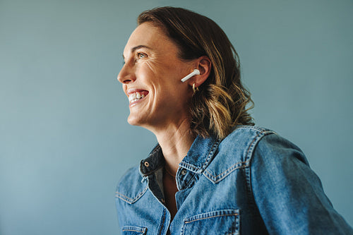 Confident and accomplished: Happy businesswoman in studio portrait