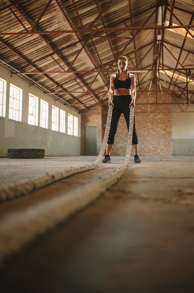 Woman about to start battling rope workout