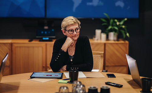 Businesswoman sitting in boardroom