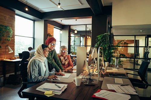 Multicultural businesswomen working together in a coworking offi