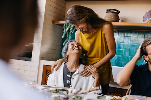 Family moments as grandmother smiles at granddaughter