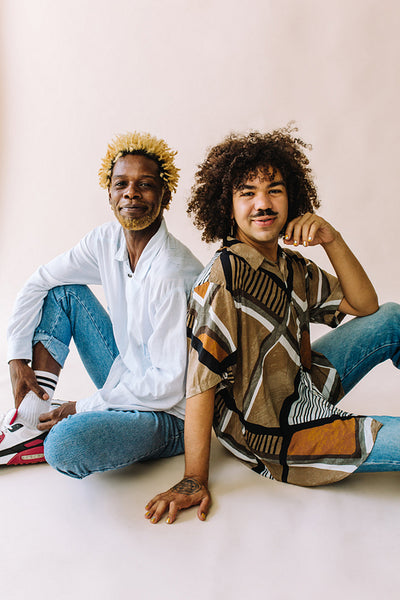 Confident gay couple looking at the camera