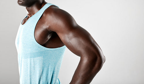 Young african man muscular arms