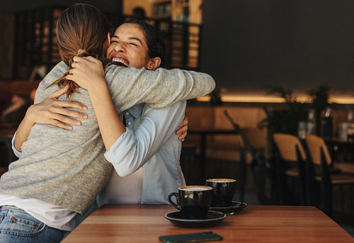Female friends meeting in a coffee shop
