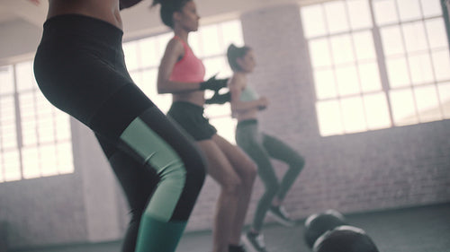 Women doing exercise with medicine ball in gym