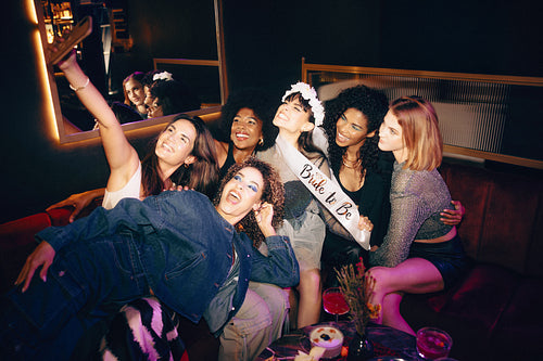 Group of women celebrating a bachelorette party with joy and laughter