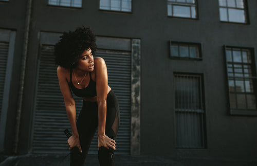 Fitness woman looking tired after workout