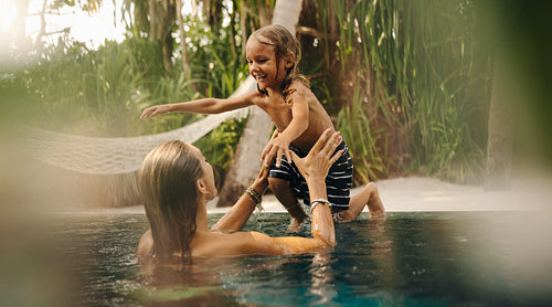 Family fun in the pool at a tropical resort holiday