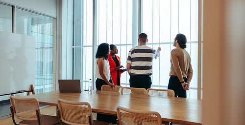 Team brainstorming for innovative ideas in a modern boardroom setting
