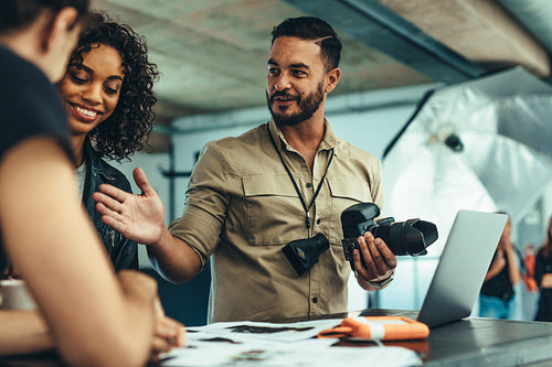 Photographer doing a post production review of photo shoot