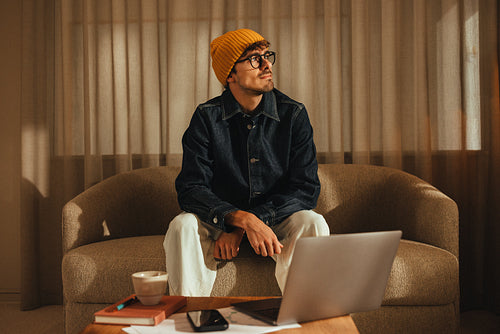 Work from home: freelancer on laptop relaxing on the sofa