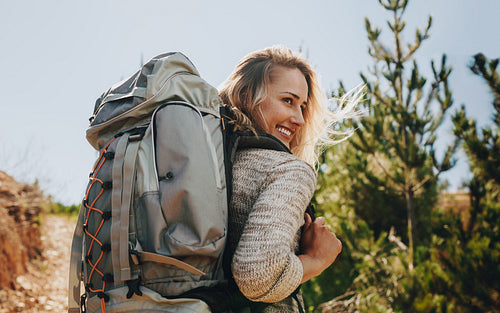 Smiling woman going on a camping