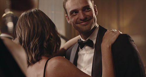 Loving young couple dancing at a party