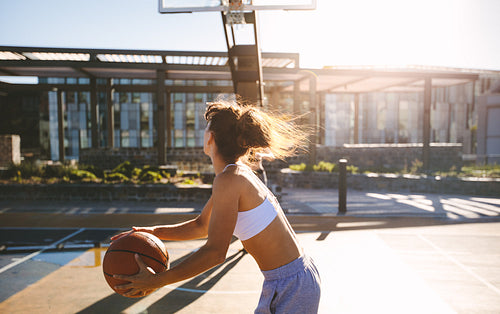 Woman playing streetbasket