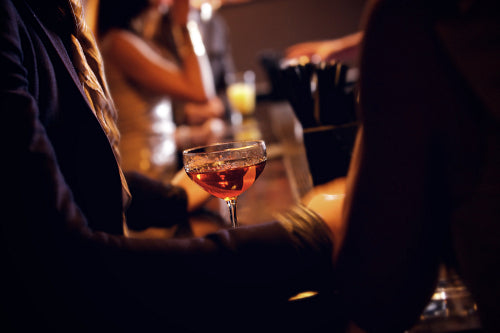 Party People with Wineglass on Focus