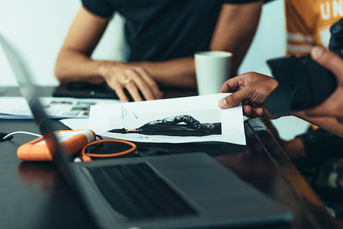 Photographer discussing the photo shoot with his crew