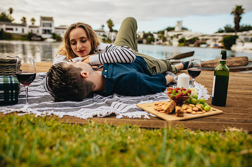 Couple enjoying their date near a lake