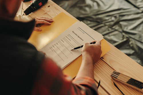 Contractor signing a home renovation contract