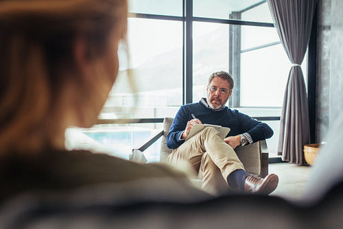 Psychotherapist listening to issues of patient