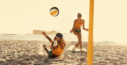 Dynamic beach volleyball game with brazilian team, pro athletes in action on sandy court
