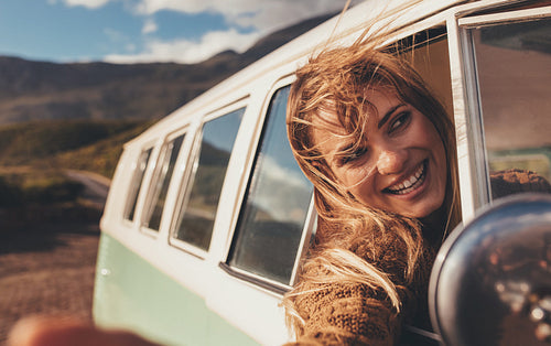 Woman enjoying on the road trip