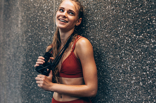 Sportswoman relaxing after intense exercising