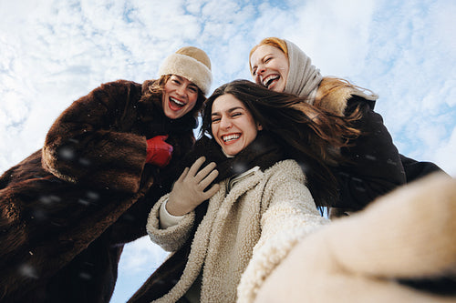Snowy women take a selfie under a blue sky