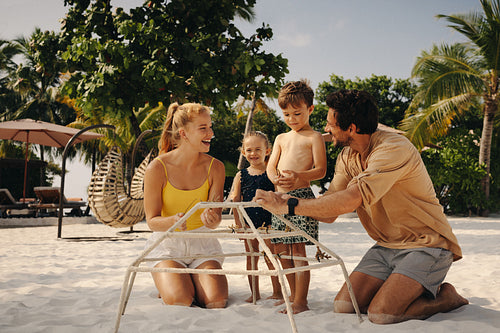 Family bonding during a reef restoration project at a luxury beach resort