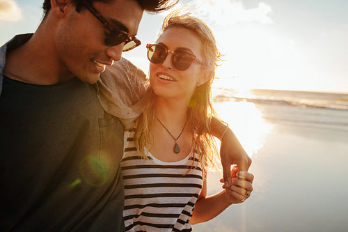 Beautiful woman with her boyfriend on the beach