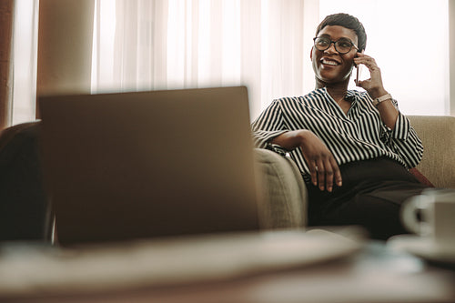 Woman CEO on business trip talking on phone