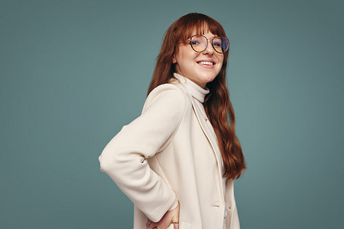 Woman with eyeglasses smiling at the camera