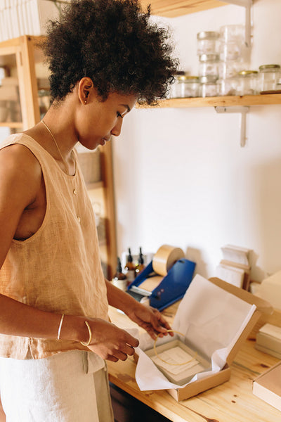 Jewelry business owner preparing the package to delivery