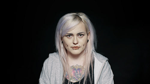 Fashionable woman staring at camera