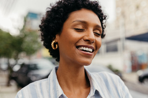 Ethnic young woman smiling cheerfully