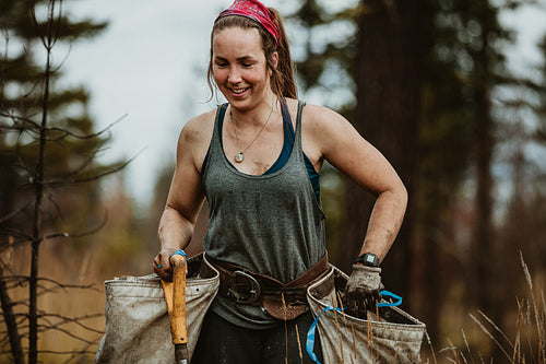 Woman planting trees in forest