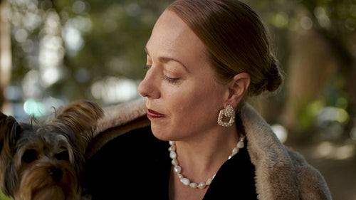 Beautiful mature woman with her pet dog