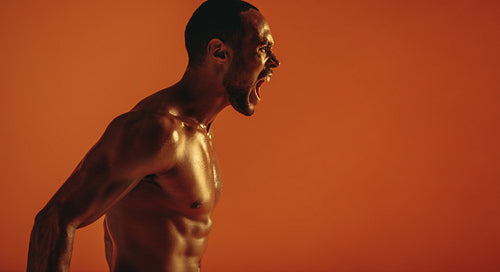 Close up of fit muscular man shouting