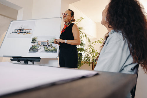 Mature project manager delivering a presentation on architectural scope
