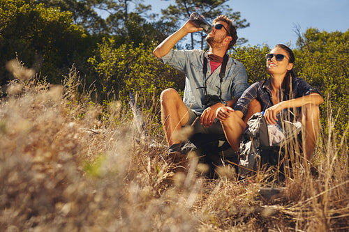 Young couple taking a break on hike