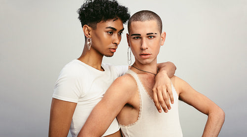 Two androgynous men posing together