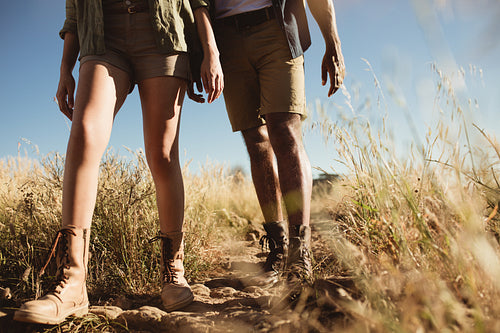 Hiker couple walking on rough terrain