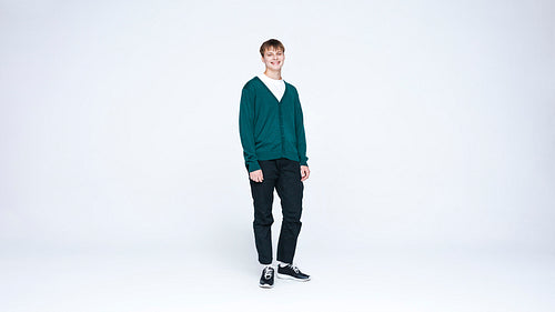 Caucasian man standing against white background