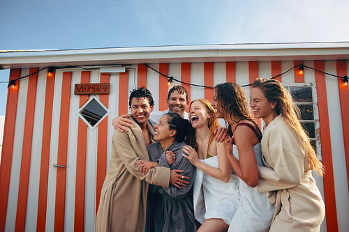 A wellness moment with friends outside a Nordic bathhouse after sauna