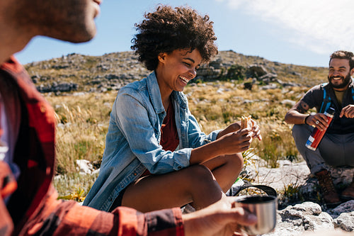 Woman with friends taking a break during hike