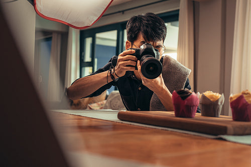 Food photographer shooting in his studio