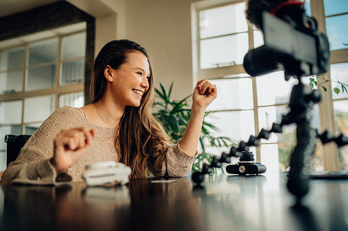 Female blogger recording content on camera