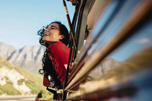 Woman having fun on car ride